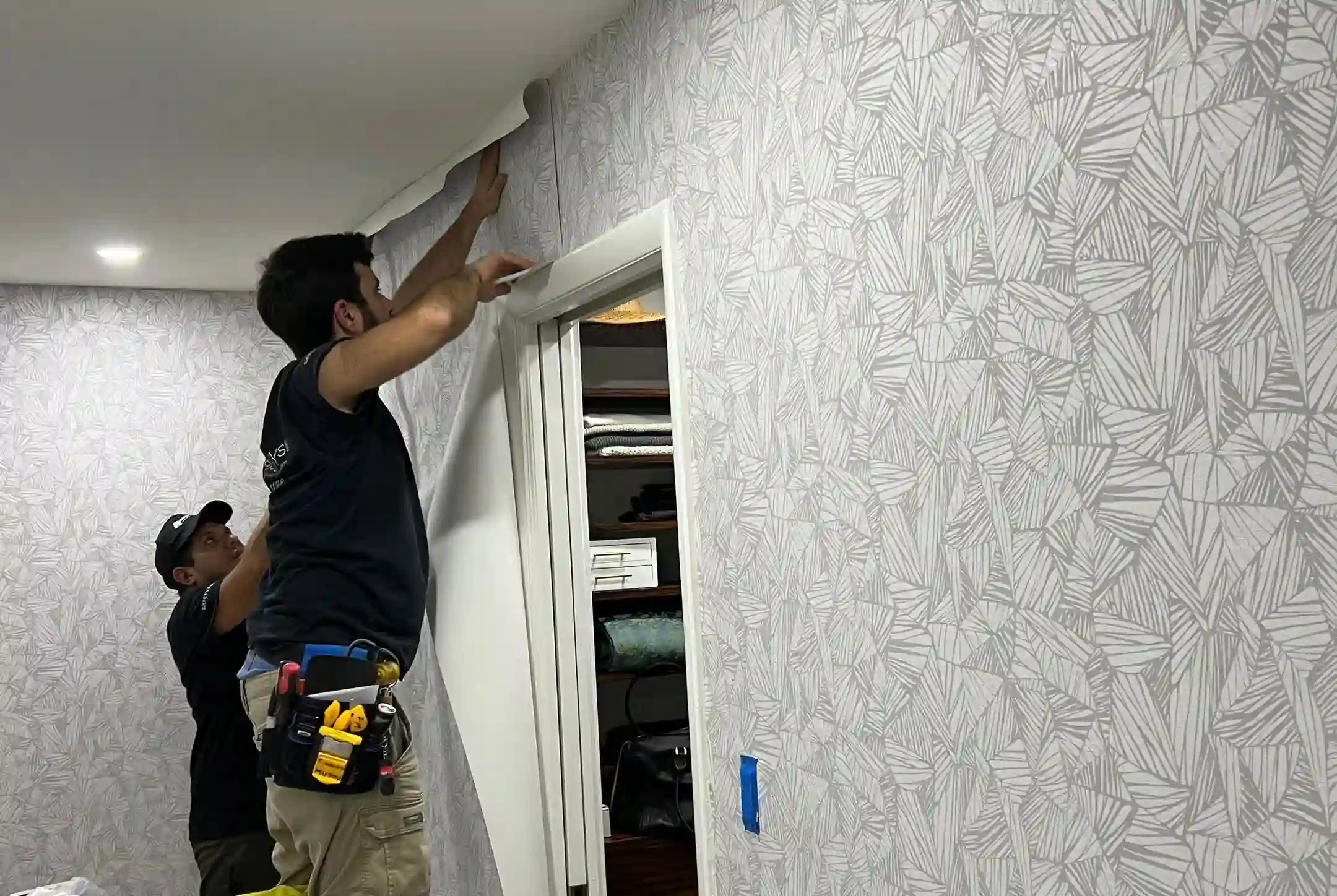 Designer wallpaper bedroom installation